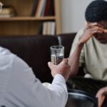 psychotherapist supporting patient at office yw4x4h6