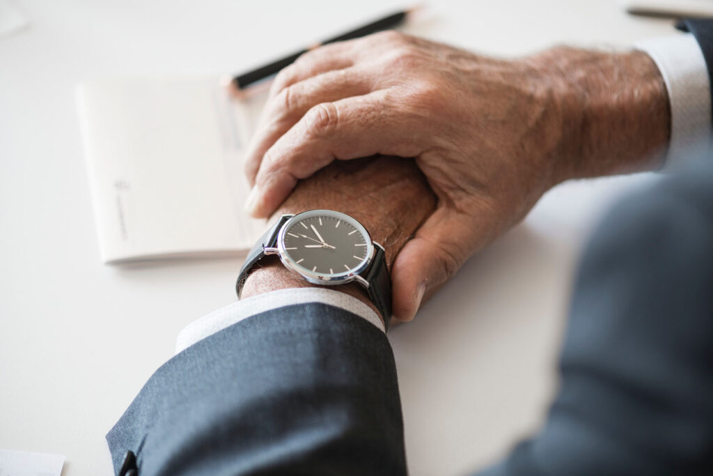 Hands together with watch on the wrist