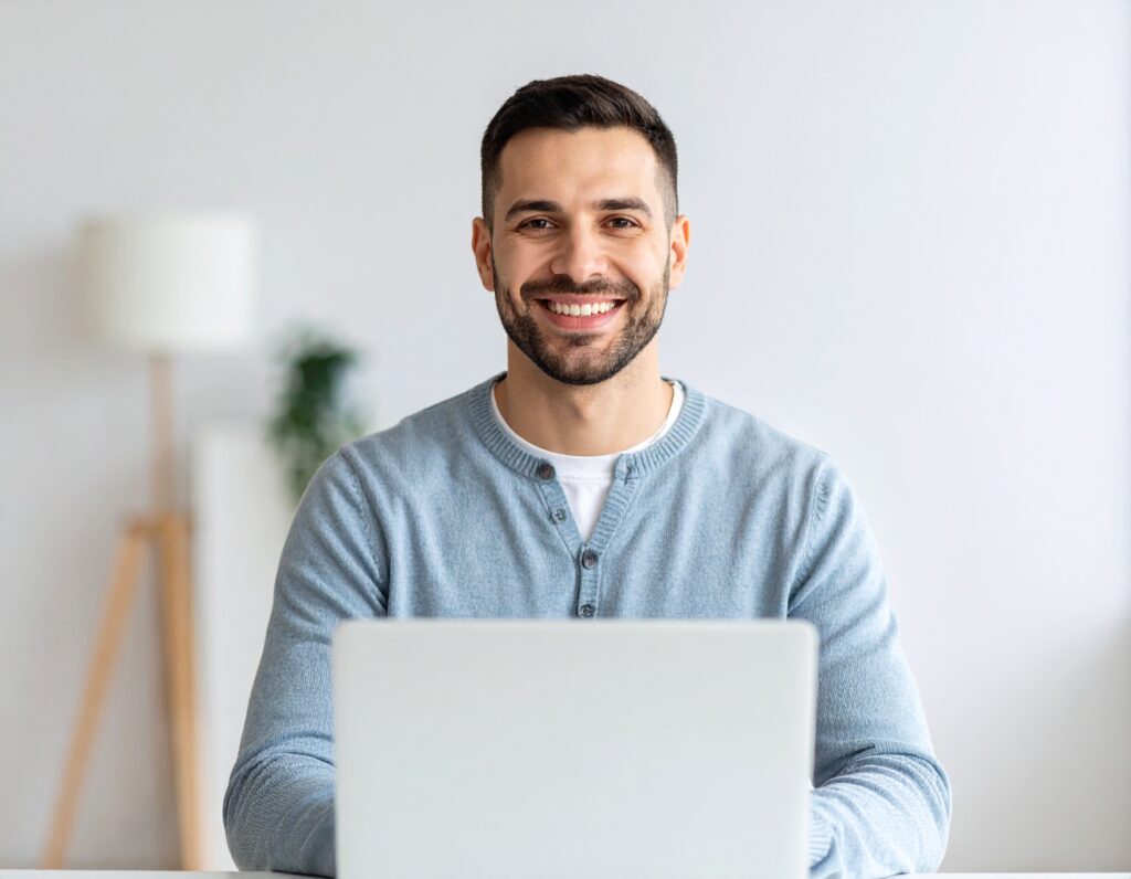 woman sitting in front of an open laptop