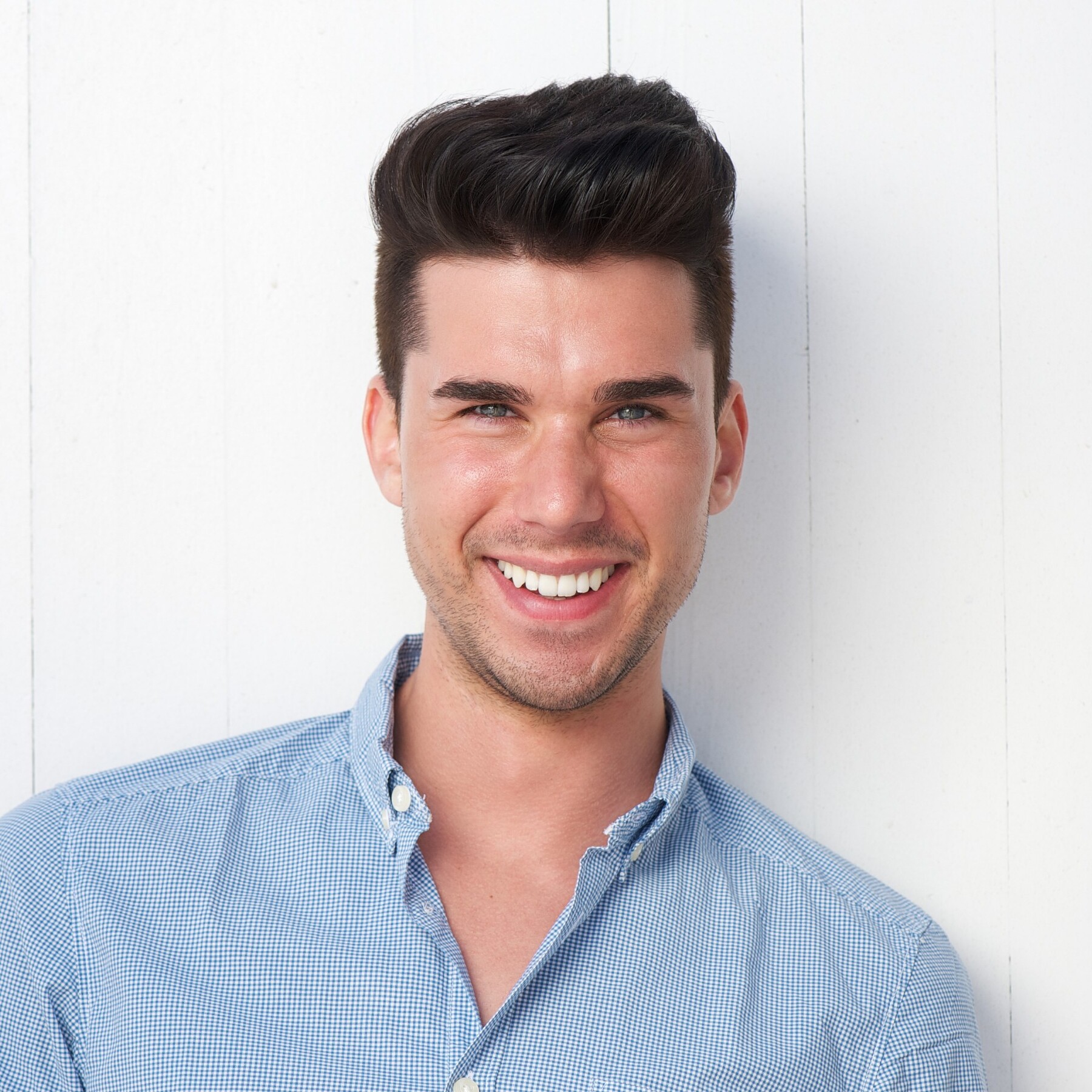 attractive young man smiling outdoors p4rt2ml.jpg